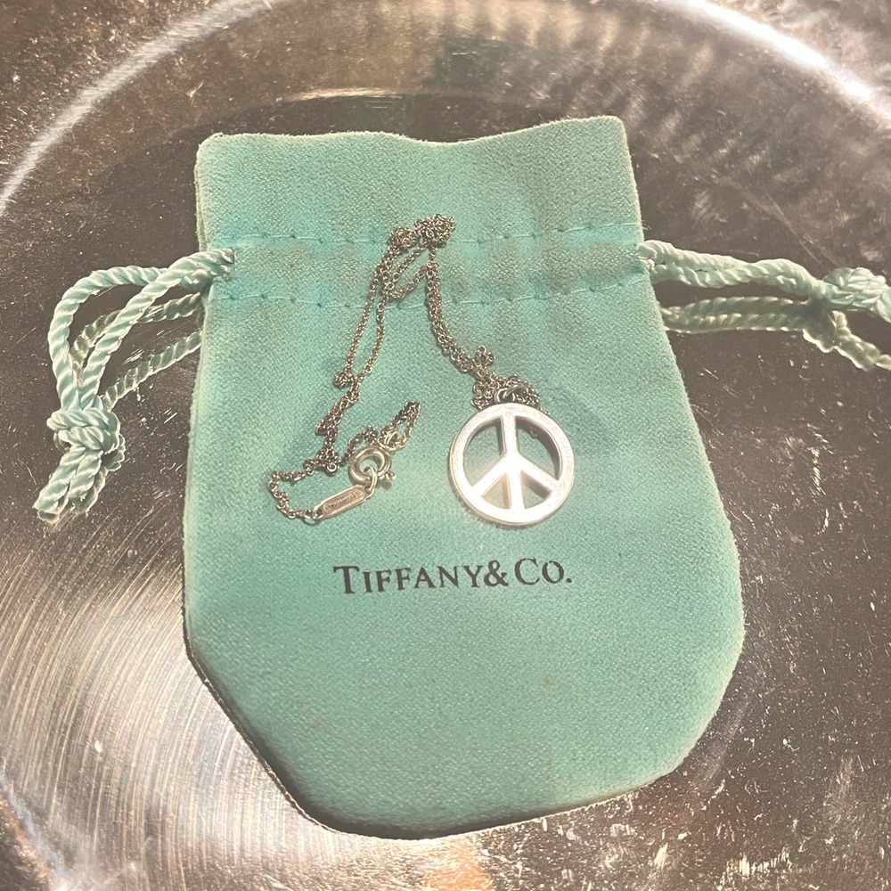 A Tiffany & Co necklace with a peace sign
